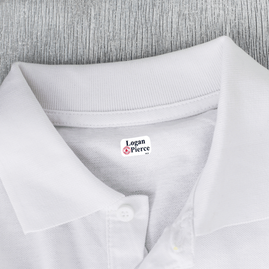 X-small clothing label on white shirt.